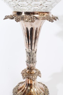 Lot 275 - Impressive 19th century silver plated table centre with tapered central column, relief decoration of fruiting vines and removable cut glass bowl, raised on four scroll feet, marks to underside of b...