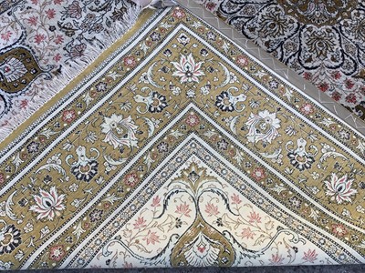 Lot 1013 - Kashan part rug silk, with cream ground and petalled medallion and concentric bird and foliate surround, in multiple bronze borders and tassel ends, approximately 220 x 310cm