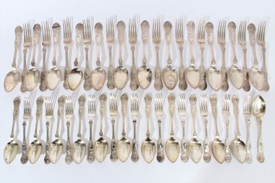 Lot 284 - Quantity of early 20th century Continental silver cutlery with raised scroll decoration and cartouche with engraved initials, comprising twelve desert spoons, twelve table spoons, twelve table fork...