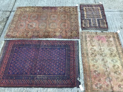 Lot 1023 - Bokhara style prayer rug, together with four further rugs