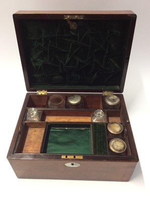 Lot 1092 - Victorian Rosewood ladies travelling vanity box containing a selection of jars and bottles in fitted interior