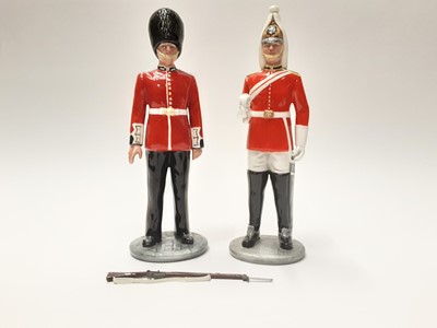 Lot 23 - Two Royal Doulton figures - The Guardsman HN2784 and The Lifeguard HN2781
