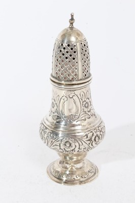 Lot 382 - Victorian silver pepperette of baluster form with chased floral and scroll decoration, pierced slip in cover, on domed circular foot, (Chester 1897)