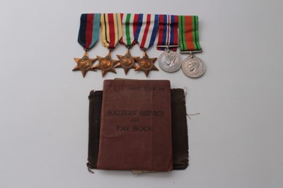 Lot 605 - Second World War medal group comprising 1939 - 1945 Star, Africa Star, Italy Star, France and Germany Star, War and Defence medals (mounted on bar) together with original service book and papers na...