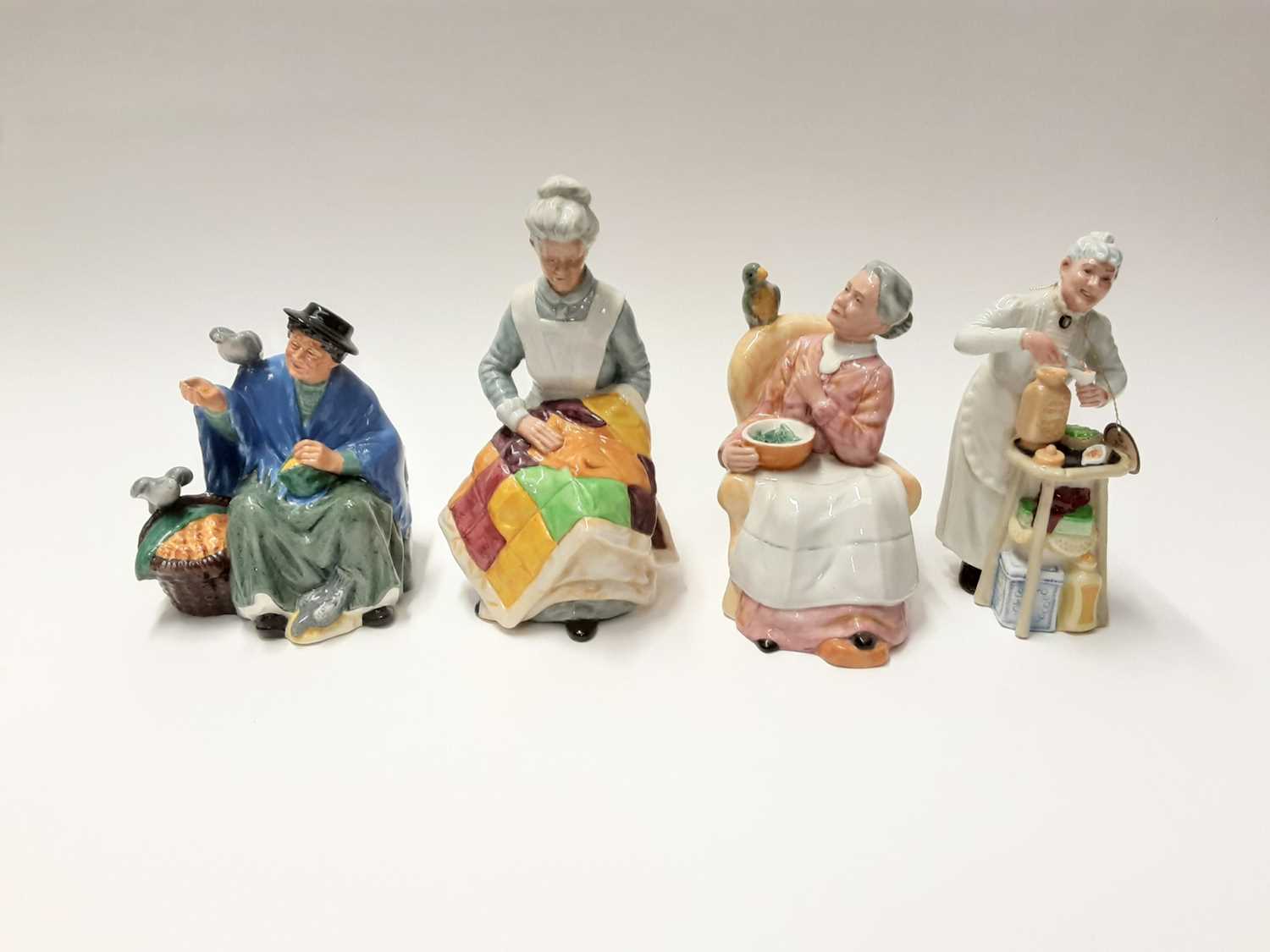 Lot 69 - Four Royal Doulton figures - Eventide HN2814, Tuppence A Bag HN2320, A Penny's Worth HN2408 and Pretty Polly HN2768