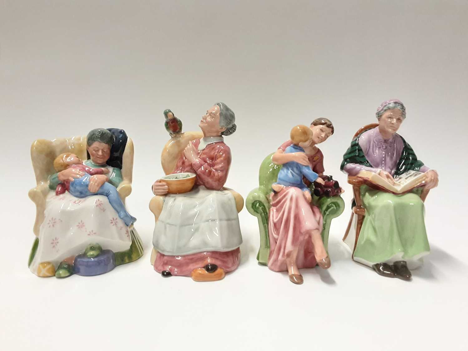Lot 70 - Four Royal Doulton figures - The Family Album HN2321, When I Was Young HN3457, Pretty Polly HN2768 and Sweet Dreams HN2380