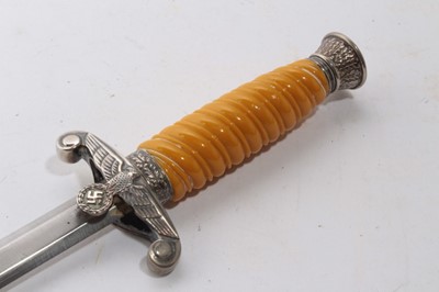 Lot 947 - Second World War Nazi Wehrmacht 1935 pattern officers' dress dagger with silver plated pommel and crossguard, plastic grip, plain blade - retaining almost all original polish in scabbard