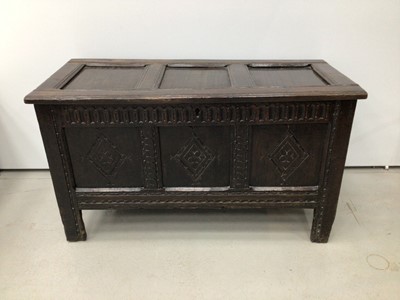 Lot 78 - 17th century carved oak coffer with triple panel front