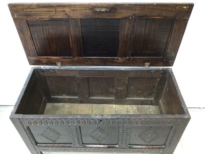 Lot 111 - 17th century carved oak coffer with triple panel front