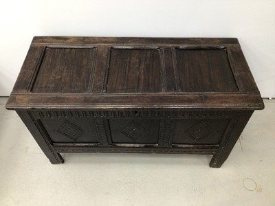 Lot 111 - 17th century carved oak coffer with triple panel front