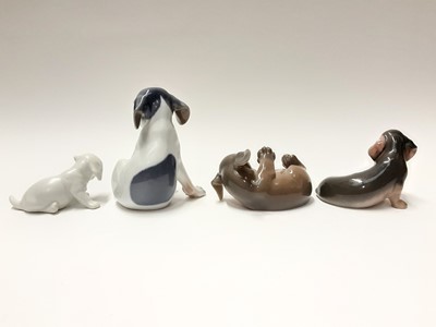Lot 155 - Four Royal Copenhagen porcelain dogs, model numbers 206, 1408, 3140 and 1311