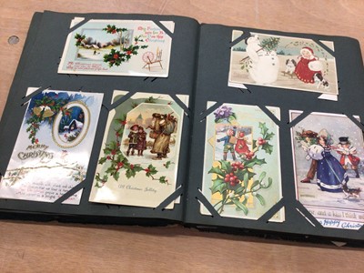 Lot 1412 - Early 20th century postcard album containing postcards, Christmas cards, and birthday cards