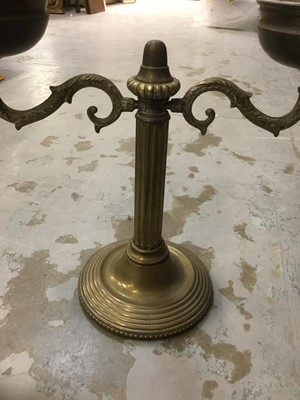 Lot 386 - Antique brass oil lamp with twin shades.