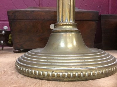 Lot 386 - Antique brass oil lamp with twin shades.