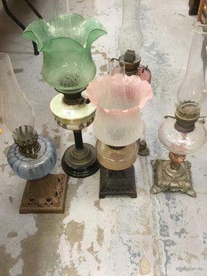 Lot 387 - Collection of five antique oil lamps