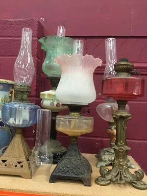 Lot 374 - Collection of five antique oil lamps