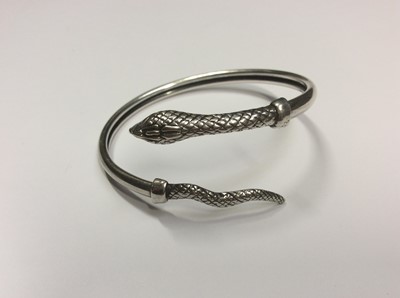 Lot 505 - Two engraved hinged silver bangles, silver snake torque bangle and silver Greek key design bangle (4)