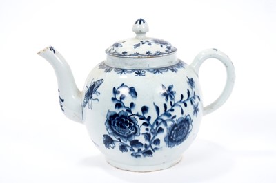 Lot 2 - Large Lowestoft teapot and cover, painted in blue with flowers and insects, painter's number 5 inside footrim, 17.5cm high 
Sold by Bonhams, 19 April 2011, lot 175