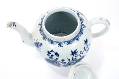 Lot 2 - Large Lowestoft teapot and cover, painted in blue with flowers and insects, painter's number 5 inside footrim, 17.5cm high 
Sold by Bonhams, 19 April 2011, lot 175
