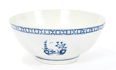 Lot 5 - Lowestoft slop bowl, of Hughes-type, moulded in relief with diaper and scolled borders, circular panels painted in blue with three different Chinese river scenes, a key and cell border below the ex...