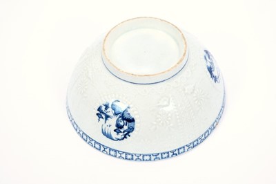 Lot 5 - Lowestoft slop bowl, of Hughes-type, moulded in relief with diaper and scolled borders, circular panels painted in blue with three different Chinese river scenes, a key and cell border below the ex...