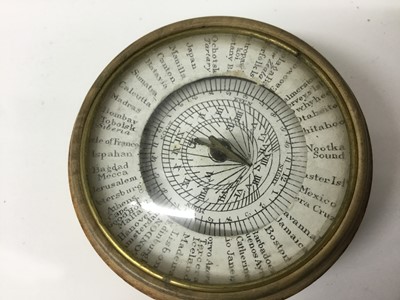 Lot 1082 - Rare 19th century pantochronometer, with central compass and outer dial inscribed with world locations, glazed cover and turned lidded sycamore case, 5cm wide