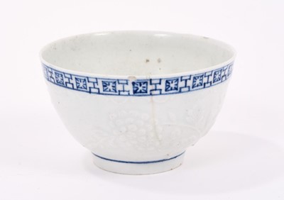 Lot 8 - Rare Lowestoft tea bowl, moulded in relief with flowers, key and cell border above, 7.5cm diameter