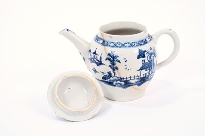 Lot 12 - Lowestoft teapot and cover, of globular form with a straight spout and button finial, painted in blue with a Chinese landscape, 10.7cm high