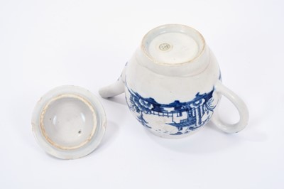 Lot 12 - Lowestoft teapot and cover, of globular form with a straight spout and button finial, painted in blue with a Chinese landscape, 10.7cm high