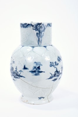 Lot 15 - Lowestoft jug, of large size, the neck moulded with flowers and leaves, the shoulder with lappets and flowers, painted in blue with a fisherman within an elaborate Chinese river scene, painter's nu...