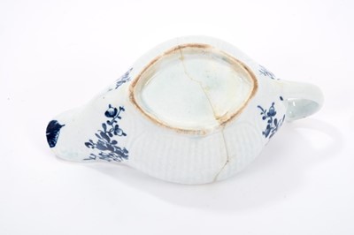 Lot 18 - Lowestoft sauceboat, of early form with basketweave panels to the sides, blue floral sprays flanking the spout and handle, a half flowerhead and diaper border inside the rim, 15.3cm long