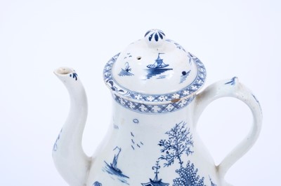 Lot 19 - Lowestoft coffee pot and cover, with a curved spout and button finial, painted in blue with a Chinese river scene within diaper borders, 23.5cm high