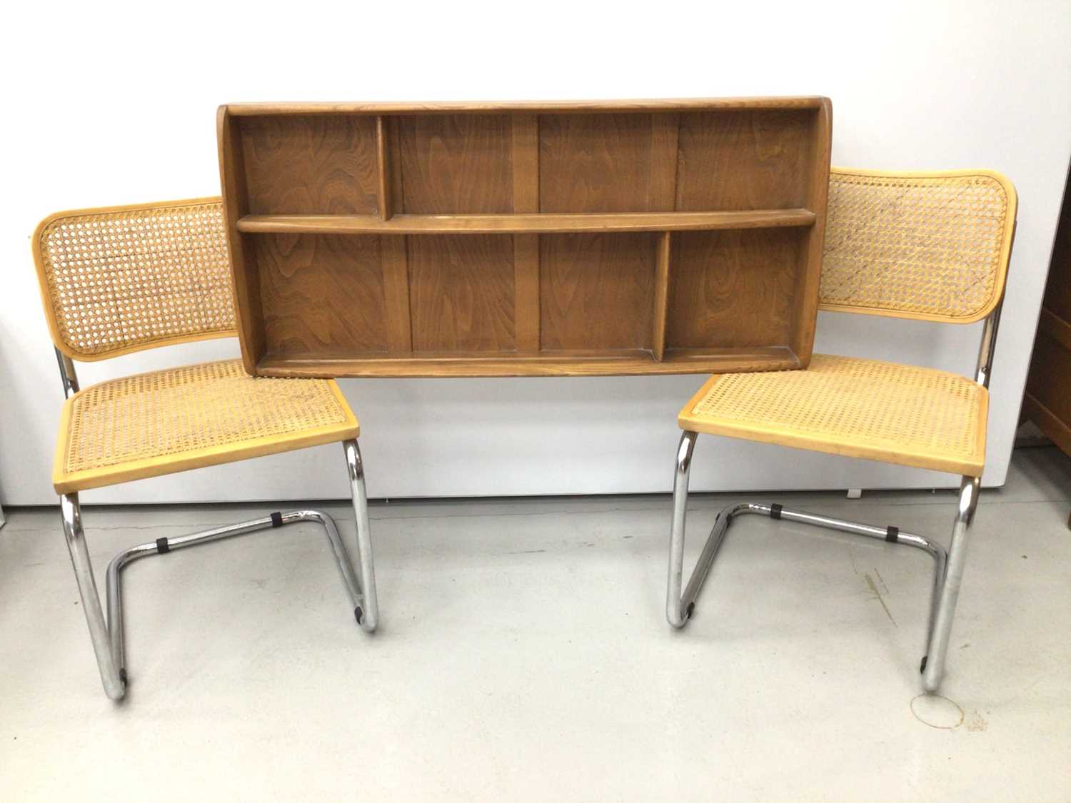 Lot 12 - Ercol golden dawn wall hanging shelves, together with a pair of Italian chrome and caned S-form chairs