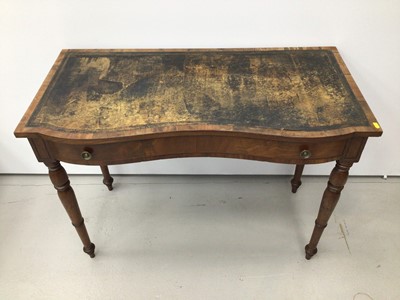 Lot 20 - Victorian figured mahogany serpentine front writing table, together with a Regency mahogany carver chair