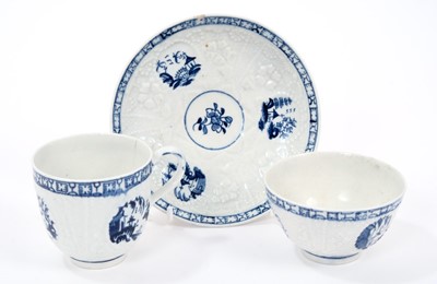 Lot 22 - Lowestoft tea bowl, coffee cup and saucer, of Hughes type with moulded florets, trelliswork and circular panels painted in blue with various Chinese landscapes, saucer 12cm diameter