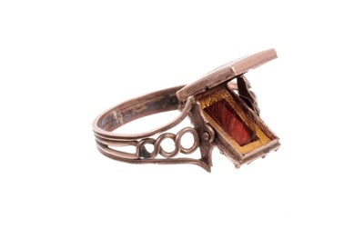 Lot 468 - George III mourning ring with rotating enamel and carnelian locket plaque