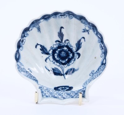 Lot 29 - Lowestoft pickle dish, of scallop shell form, painted in blue with a chrysanthemum within a scrolled border, 10.8cm long