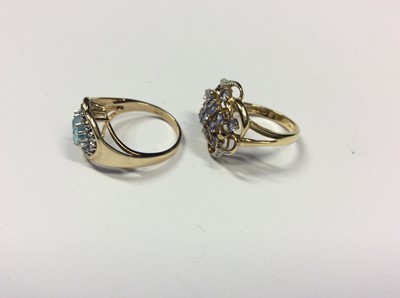 Lot 515 - 14ct gold heart shaped gem set dress ring and 9ct gold flower shaped gem set dress ring (2)
