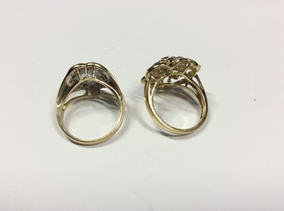 Lot 515 - 14ct gold heart shaped gem set dress ring and 9ct gold flower shaped gem set dress ring (2)