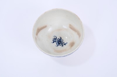 Lot 33 - Lowestoft tea bowl, moulded with panels painted in blue with flowers, moulded flowers in between, within a blue cell border, 7.5cm diameter