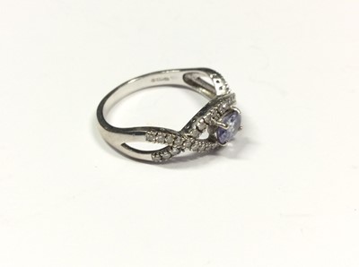 Lot 520 - 18ct white gold pale purple/blue stone and diamond ring. Size P