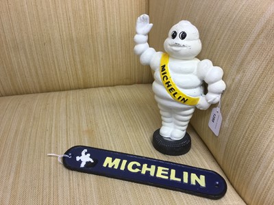 Lot 1288 - Reproduction Michelin man money box together with a Michelin man plaque (2)