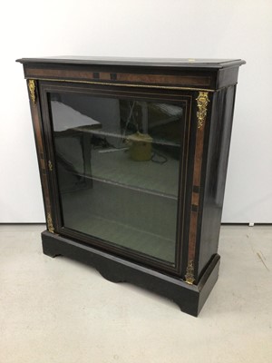 Lot 60 - Victorian ebonised and gilt metal mounted pier cabinet, enclosed by glazed door on shaped plinth, 93cm wide x 29cm deep x 103cm high