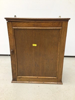 Lot 64 - Antique pine wall hanging cupboard or salt box, accessed from the hinged lid, 88cm high, together with two hanging corner cupboards and one other hanging cupboard. (4)