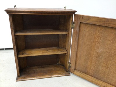 Lot 64 - Antique pine wall hanging cupboard or salt box, accessed from the hinged lid, 88cm high, together with two hanging corner cupboards and one other hanging cupboard. (4)