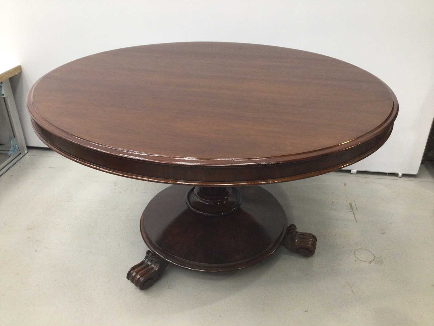 Lot 72 - Victorian mahogany circular breakfast table, the tilt top on facetted tapered column and circular base on scroll feet, 124cm diameter