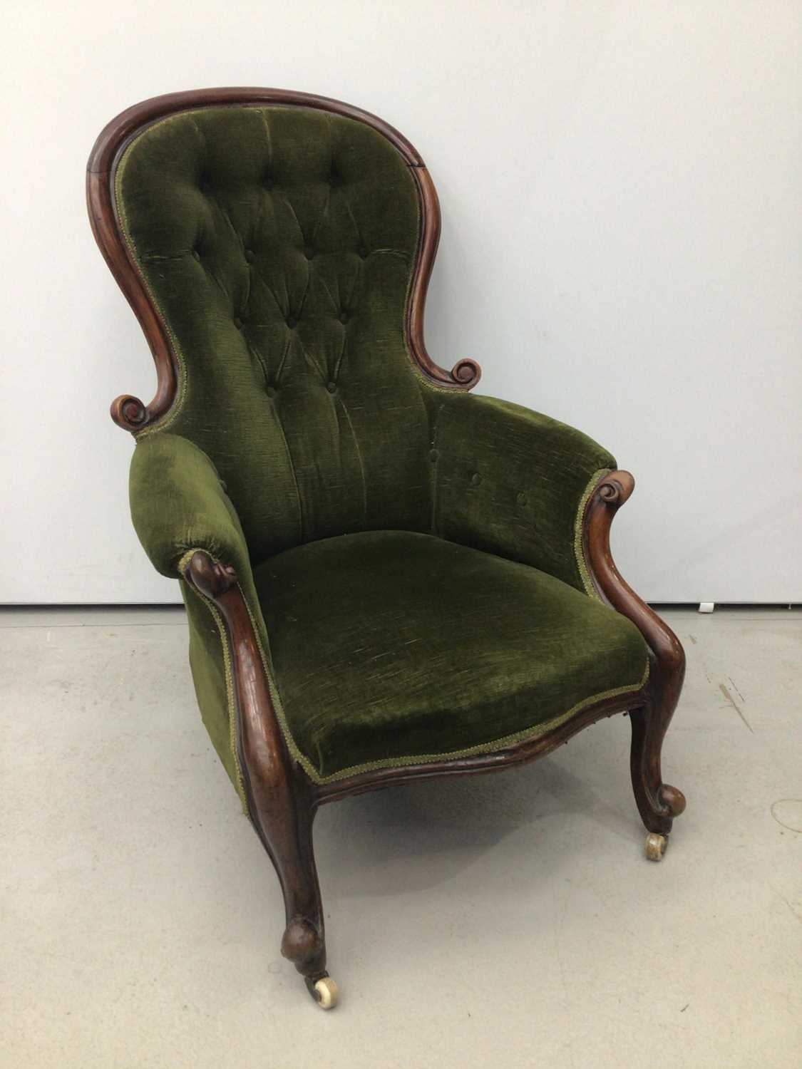 Lot 75 - Victorian mahogany mahogany spoon back armchair, with green button velvet upholstery and showwood frame on cabriole legs and castors