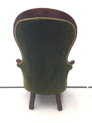 Lot 75 - Victorian mahogany mahogany spoon back armchair, with green button velvet upholstery and showwood frame on cabriole legs and castors