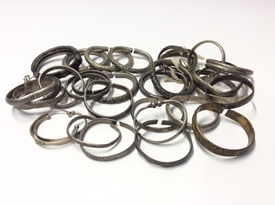 Lot 533 - Collection of thirty three Chinese and Eastern white metal and base metal bangles