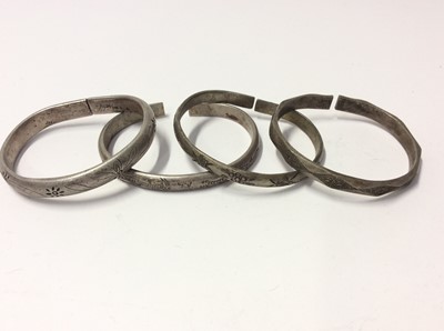 Lot 533 - Collection of thirty three Chinese and Eastern white metal and base metal bangles